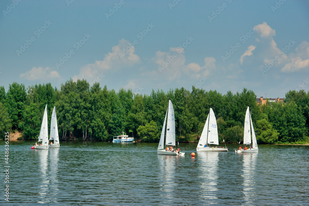 Moscow, Russia - July 15, 2021: Sailboats on the river, Klyazminskoye reservoir near Moscow