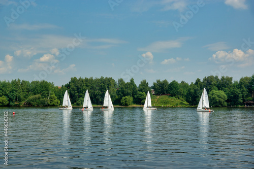 Moscow, Russia - July 15, 2021: Sailboats on the river, Klyazminskoye reservoir near Moscow photo