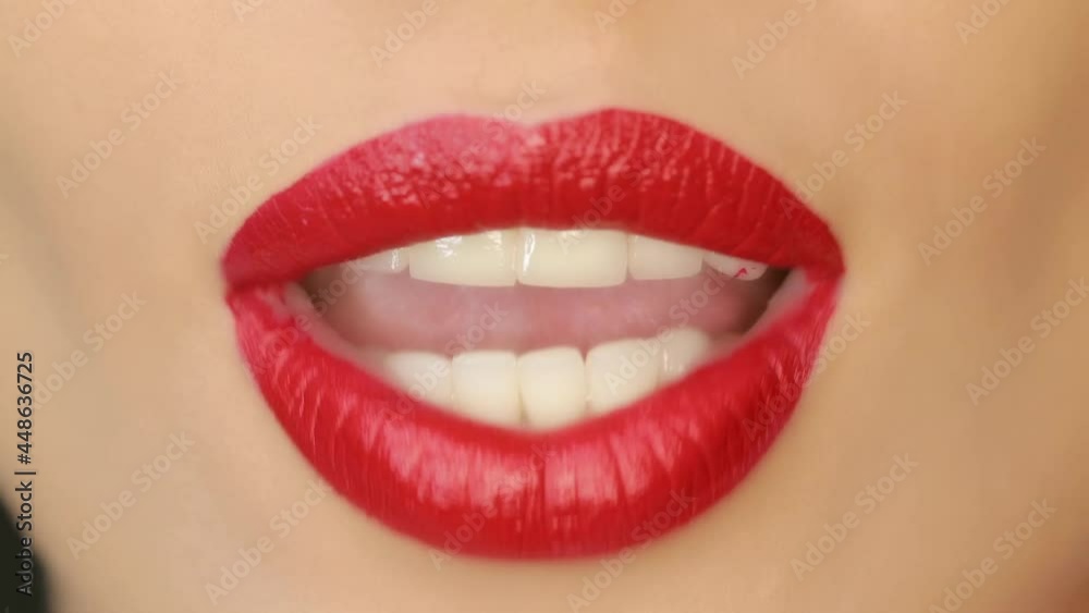 Closeup of a beautiful woman lips with beautiful makeup sending air kiss . Close up of girl's mouth having flirty emotions and sending air kiss . Closeup of a beautiful woman lips with beautiful makeup sending air kiss . Close up of girl's mouth having flirty emotions and sending air kiss .