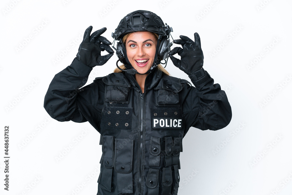 SWAT caucasian woman isolated on white background showing an ok sign with fingers