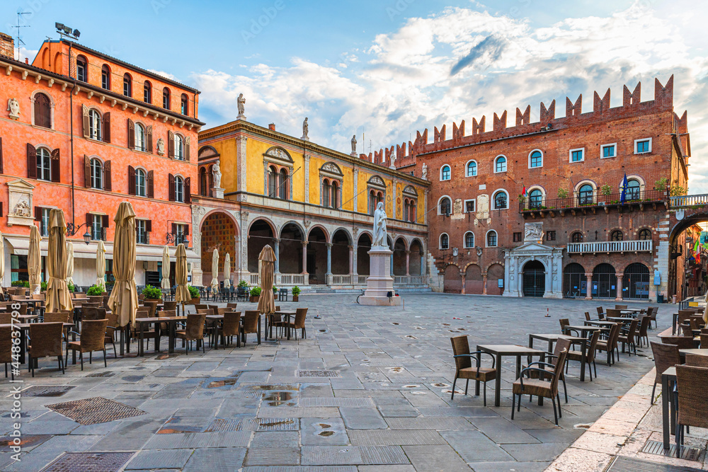 Verona old town square Piazza dei Signori with Dante statue and street cafe with nobody. Veneto, Italy