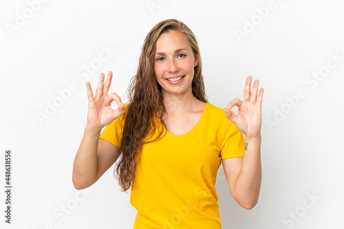 Young caucasian woman isolated on white background showing ok sign with two hands