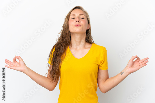 Young caucasian woman isolated on white background in zen pose