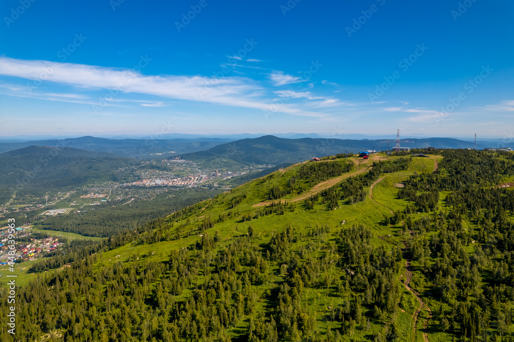 Sheregesh ski resort in summer, landscape on mountain Mustag, aerial top view Kemerovo region Russia