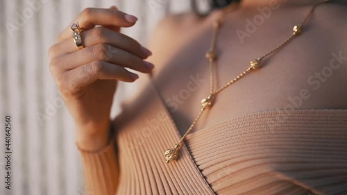 rings and necklaces on a girl close-up