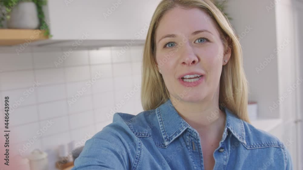 Point of view shot of woman vlogging making social media video as she carries camera around in kitchen at home - shot in slow motion Point of view shot of woman vlogging making social media video as she carries camera around in kitchen at home - shot in slow motion