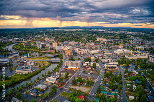 Aerial View of Downtown Fairbanks, Alaska during a stormy Summer Sunset © Jacob