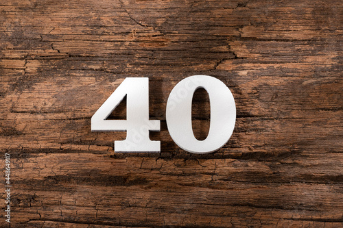 forty 40 - White wooden number on rustic background photo