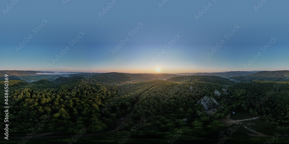 Summer panorama of Ukrainian mountain range. Beautiful summer scenery. Morning fog spreads on the mountain valley. Panoramic summer scene of Carpathian village. Amazing morning landscape of mountain. Summer panorama of Ukrainian mountain range. Beautiful summer scenery. Morning fog spreads on the mountain valley. Panoramic summer scene of Carpathian village. Amazing morning landscape of mountain.