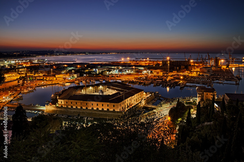 Ancona, Marche, Italy: night landscape of the port for the small boats and fishing vessels with the pentagonal Mole Vanvitelliana, built on 18th-century as a lazzaretto quarantine station photo