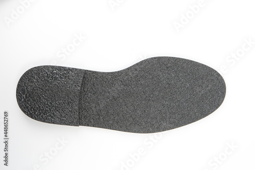 Sole of men's shoes with a heel. Rubber outsole for making boots. Wavy protector of batinks on a white background. Concept - making shoe soles. Shoe production. Production men shoes.
