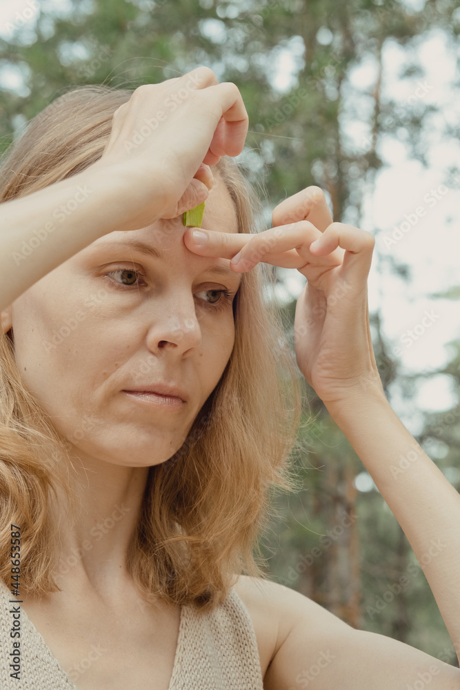 Beautiful Woman With Kinesiology Facelift Tapes. Girl beautician puts