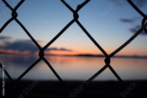 sunset over fence