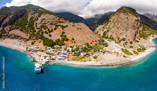 Billede på lærred AGIA ROUMELI, CRETE, GREECE - JULY 20 2021: Aerial view of the village of Agia Roumeli at the exit of the Samaria Gorge on the Greek island of Crete