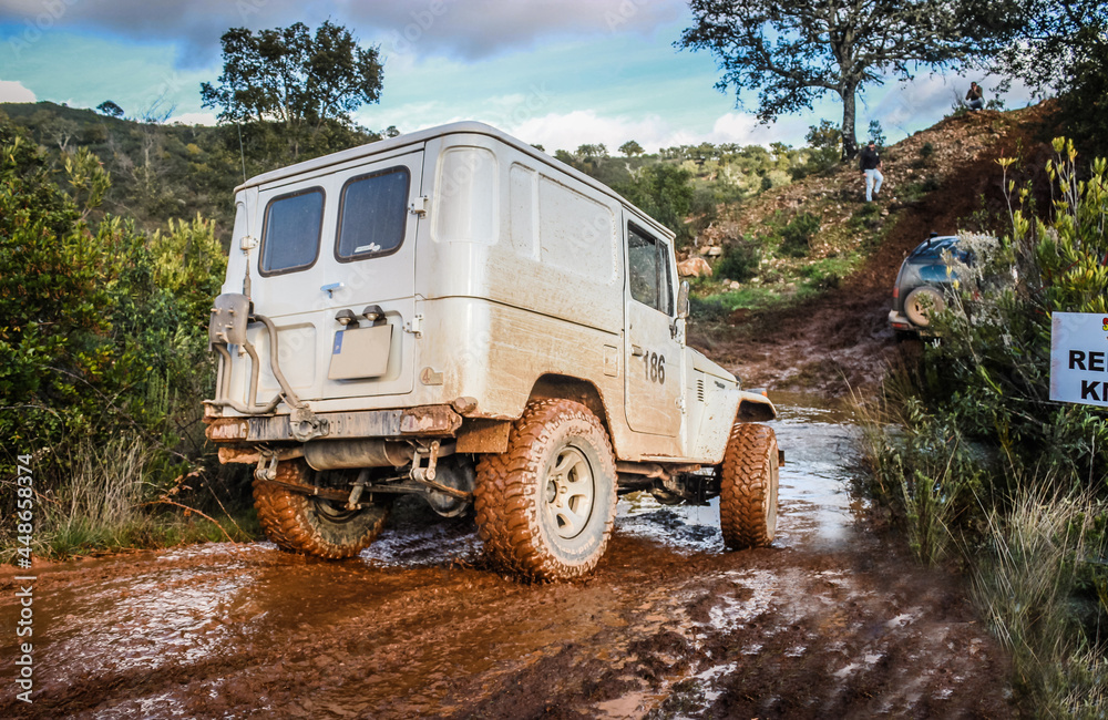 Classic 4x4 vehicle participating in a mud race