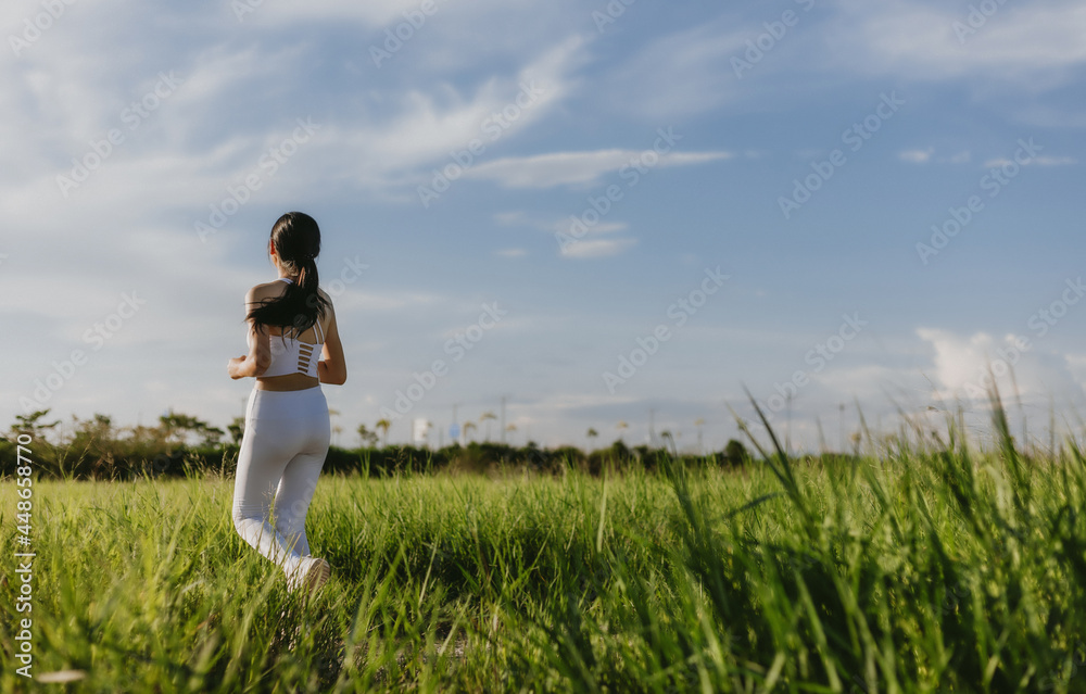 Asian young woman running outdoor, healthy lifestyle, and sport concepts Asian young woman running outdoor, healthy lifestyle, and sport concepts