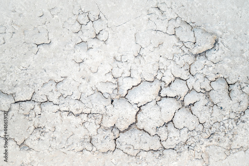 White sand background pattern on the beach with cracks