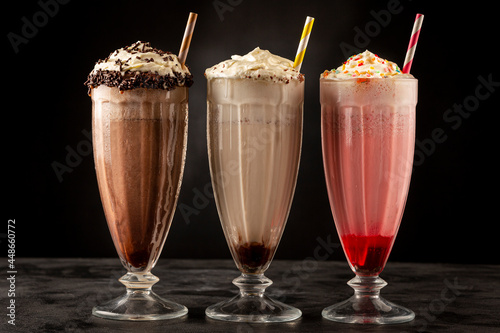 Fotografie, Obraz Three glasses of milkshake with assorted flavors