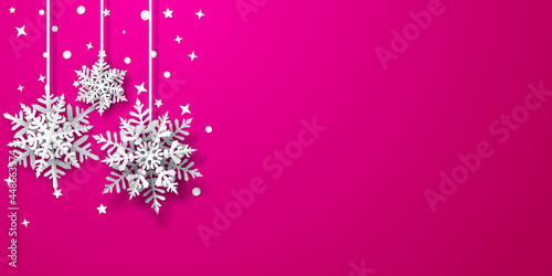 Christmas background of paper snowflakes with soft shadows, white on pink background