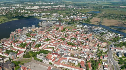 High angle view of city. Historic town centre with several churches. Warnow river flowing around town photo