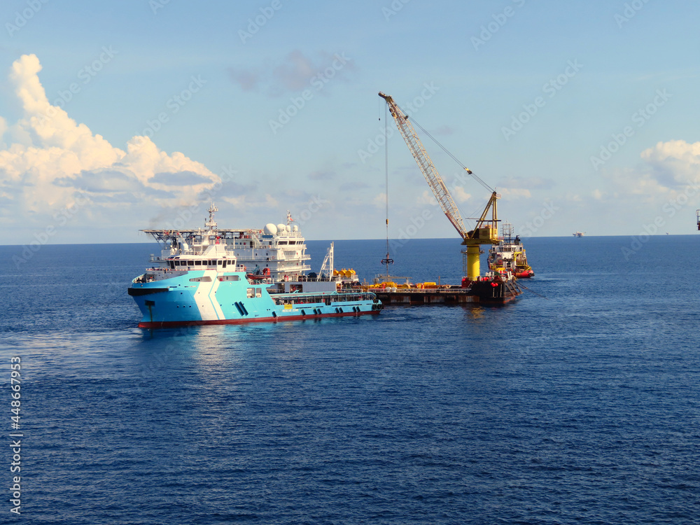 Supply boat transfer cargo to oil and gas industry is moving Offshore Accommodation Barge to serve as an offshore hotel to personnel and crew. Supply boat transfer cargo to oil and gas industry is moving Offshore Accommodation Barge to serve as an offshore hotel to personnel and crew.