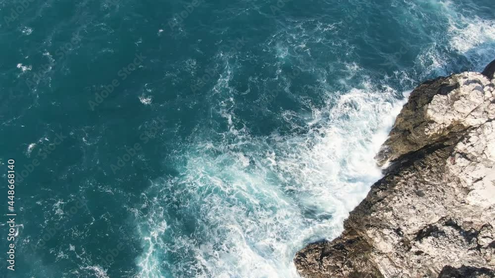 Powerful Waves Breaking On The Rocks At The Coast Of Adriatic Sea. Polignano a Mare Commune In Bari, Apulia, Southern Italy. aerial top-down Powerful Waves Breaking On The Rocks At The Coast Of Adriatic Sea. Polignano a Mare Commune In Bari, Apulia, Southern Italy. aerial top-down