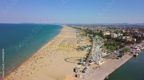 Aerial View Of The Famous Resort And Ferris Wheel In Rimini, Italy - drone shot photo