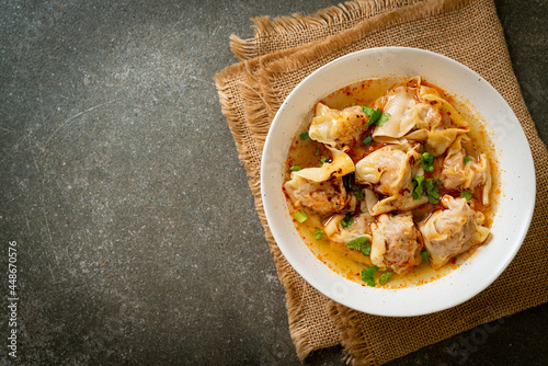 pork wonton soup or pork dumplings soup with roasted chili photo