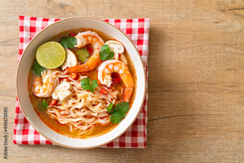 instant noodles ramen in spicy soup with shrimps (Tom Yum Kung)