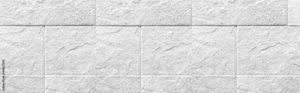 Naklejka premium Panorama of White granite tiled wall with vintage pattern texture and background seamless