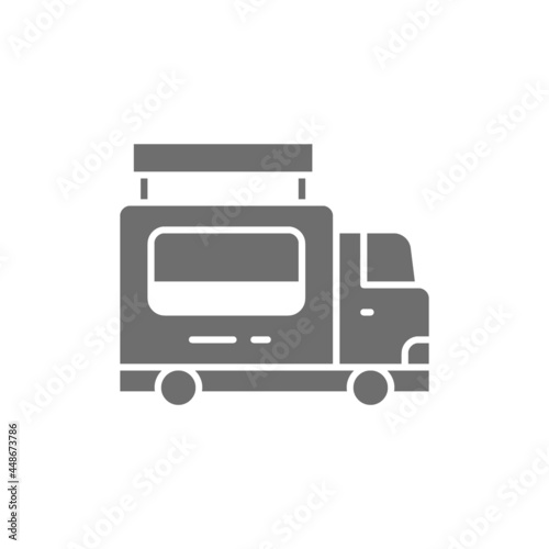 Catering food trailer, fast food truck gray icon.