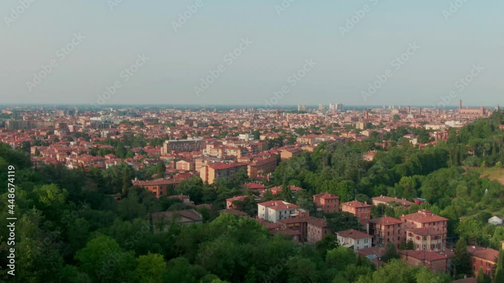 Bologna, italy on a sunny afternoon with a green park in the front and downtown bologna in the background Bologna, italy on a sunny afternoon with a green park in the front and downtown bologna in the background