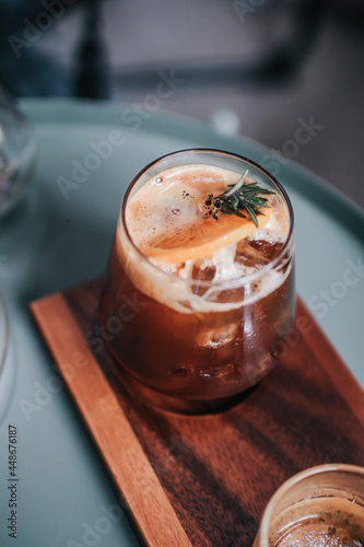 Orange and coffee non-alcoholic cocktail refreshing recipe idea. Alternative drinks making for healthy lifestyle.