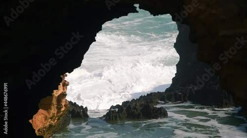 Salt water crushing on a arch shaped rock in Australia. Mother nature power photo