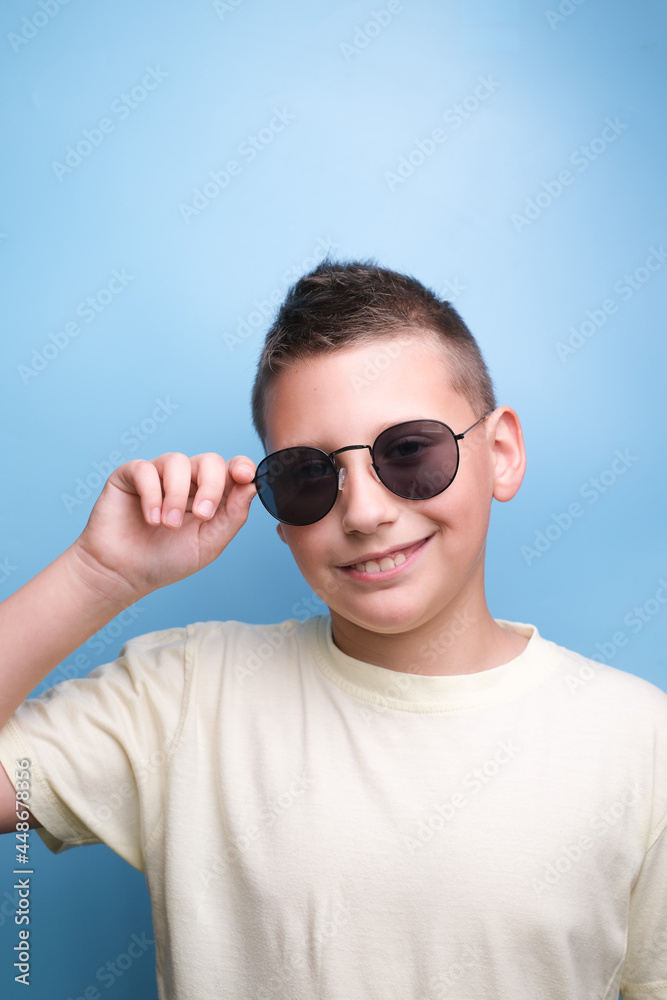 Portrait of Boy in sun glasses , smiling. Emotional face Portrait of Boy in sun glasses , smiling. Emotional face