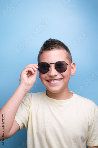 Portrait of Boy in sun glasses , smiling. Emotional face