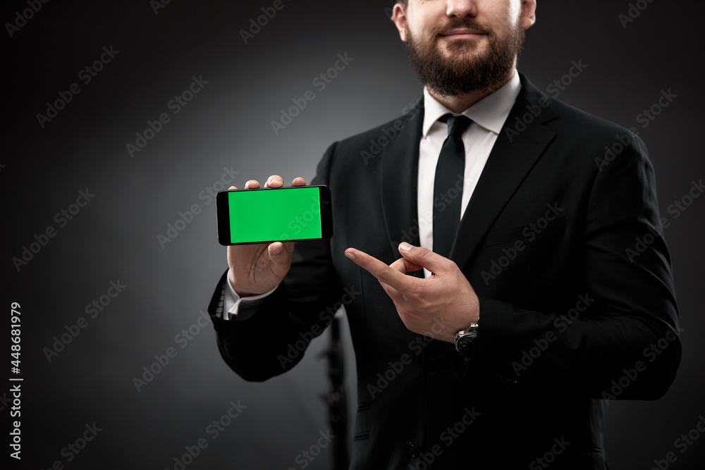 Businessman demonstrating smart phone screen Businessman demonstrating smart phone screen