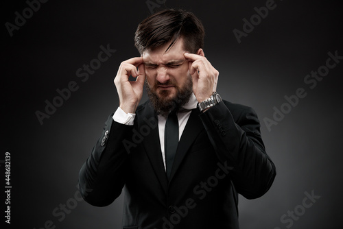 Businessman with strong painful headache