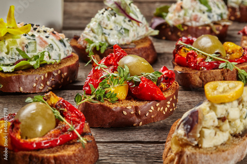 Canapes on toasted baguette slices with various toppings
