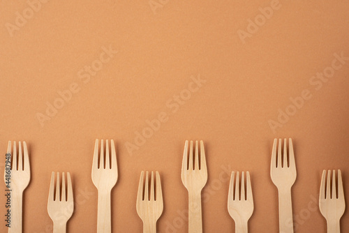 Eco friendly kitchen items . Zero waste and plastic free concept. Forks in top view on beige background. Disposable tableware. Natural products for recycle .