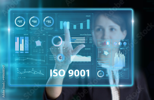 Business, Technology, Internet and network concept. Young businessman working on a virtual screen of the future and sees the inscription: ISO 9001