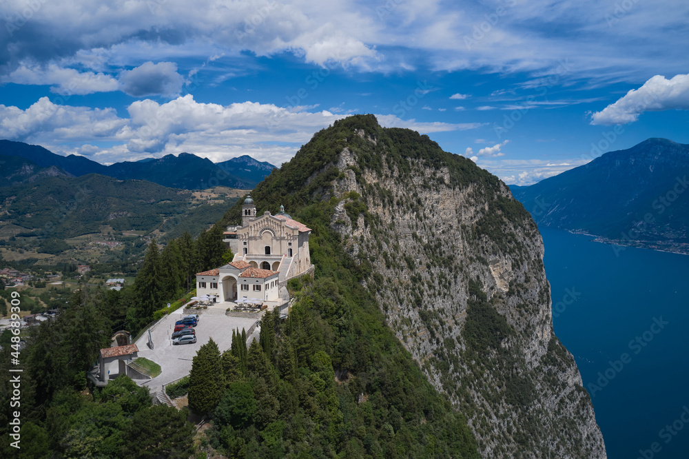 Aerial panorama of the Eremo di Montecastello church on Lake Garda. Catholic church on a mountain surrounded by the Alps. Panorama Eremo di Montecastello, Italy aerial view.