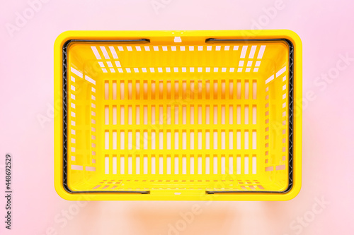 Shopping basket on color ba...
