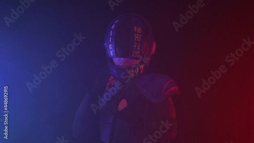Cyberpunk future concept. Police officer stands in boxing pose with fists. Halfman robot is ready for fight in dark with fume, smoke. Bionic cyborg looks at camera. Red blue light blinks. Portrait photo