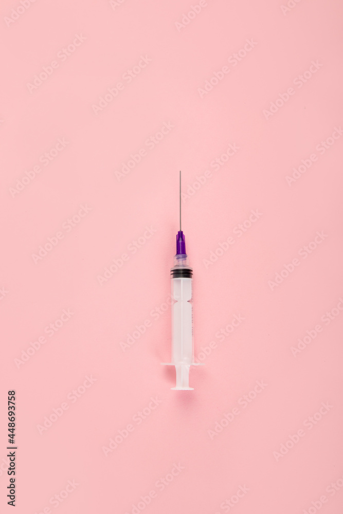 Syringes placed on pink background. Medical concept and vaccination. Syringes placed on pink background. Medical concept and vaccination.