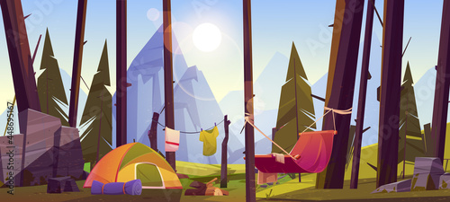 Camping tent with tourist stuff, logs and hammock