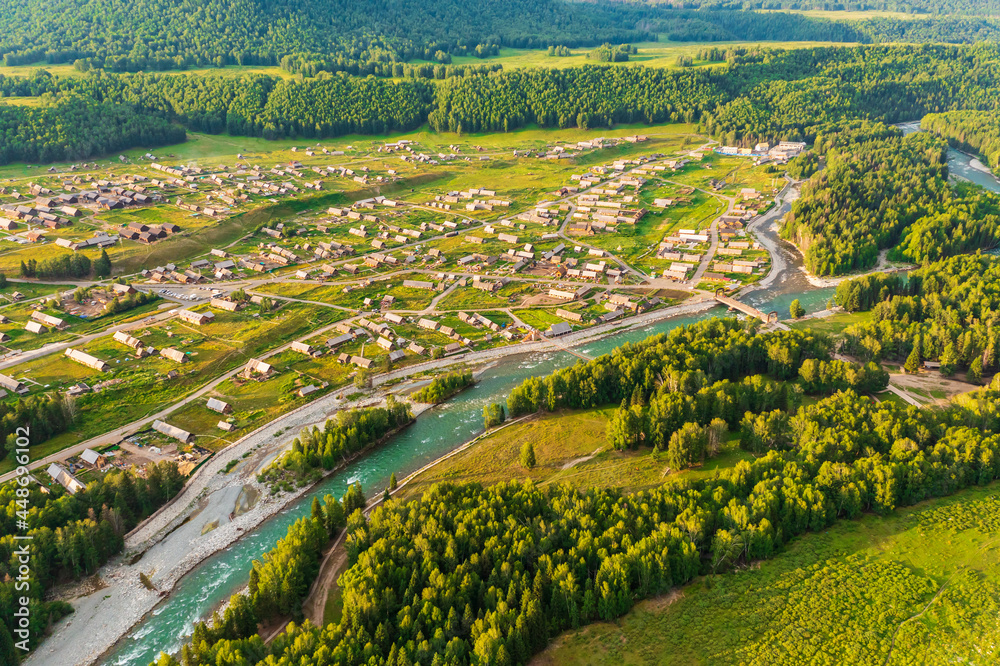 Beautiful Hemu Village with natural scenery in Xinjiang,green forest and river.Hemu Village is a famous travel destination in China.Aerial view.
