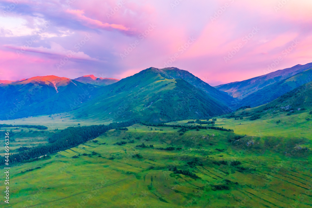 Mountain and forest with grassland natural scenery at sunrise in Hemu Village,Xinjiang,China.