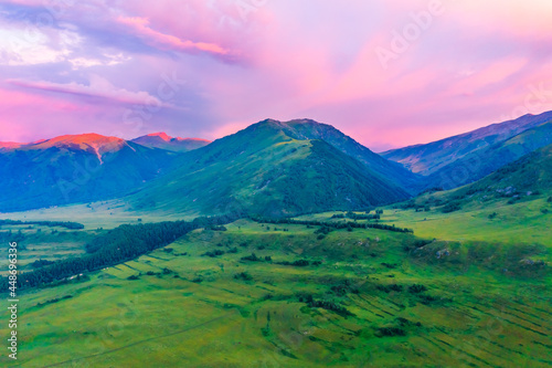 Mountain and forest with grassland natural scenery at sunrise in Hemu Village,Xinjiang,China.