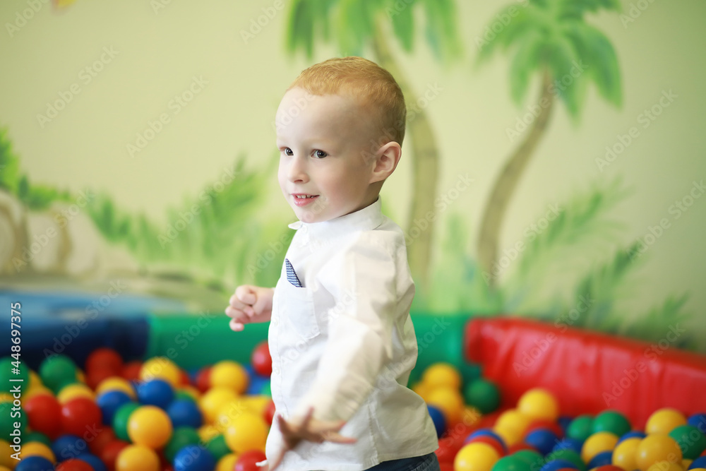 Obraz premium A small child is playing with toy